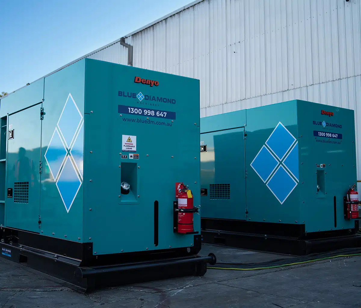 Two Denyo diesel generators standing side by side from Blue Diamond Machinery.